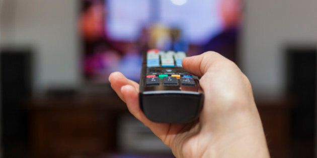 Using the remote control to change channels on Tv