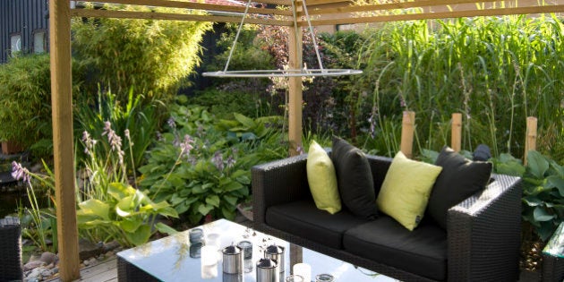 Modern outdoor living, with wicker sofas and table.