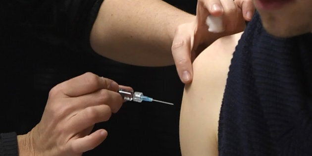 A nurse vaccinates a student against meningitis on January 4, 2017 at the University of Dijon. Thirty thousand people are invited to be vaccinated against meningitis at the campus of Dijon where two students died between October and December 2016. / AFP / PHILIPPE DESMAZES (Photo credit should read PHILIPPE DESMAZES/AFP/Getty Images)