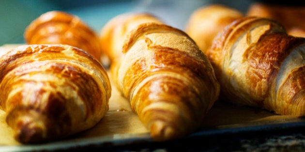 Freshly baked croissants for sale at a deli