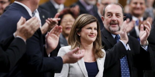 Interim Conservative Leader Rona Ambrose (C) receives a standing ovation from her caucus during a debate on the Speech from the Throne in the House of Commons on Parliament Hill in Ottawa, Canada, December 7, 2015. REUTERS/Chris Wattie