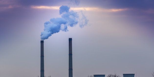 Black smoke spewed from coal powered plant smoke stacks
