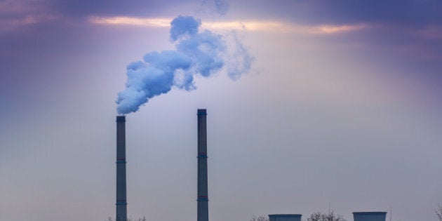 Black smoke spewed from coal powered plant smoke stacks