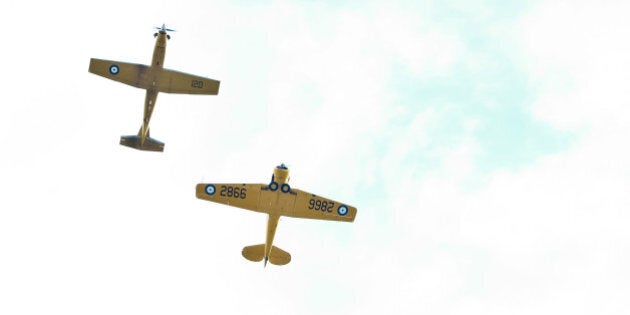 WINNIPEG, MB - OCTOBER 22: Two Royal Canadian Air Force CT 156 Harvard II aircrafts fly over during the 2016 Tim Hortons NHL Heritage Classic alumni game at Investors Group Field on October 22, 2016 in Winnipeg, Canada. (Photo by Andre Ringuette/NHLI via Getty Images)