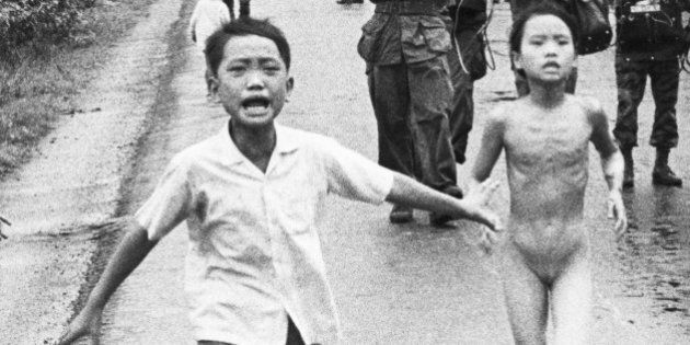 (Original Caption) 11/3/1972-Trang Bang, South Vietnam: Children run along Highway 1 June 8, 1972 in an attempt to escape an accidental napalm attack on Trang Bang, 26 miles southwest of Saigon, by South Vietnamese government aircraft. CREDIT(UPI)