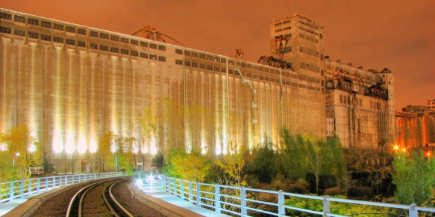 Large and familiar grain elevator complex located at foot of McGill Street and mouth of LachineCanal, popularly known as Silo No. 5, was built over period of more than fifty years, starting.
