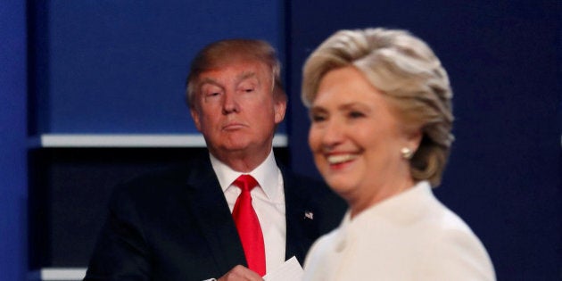 Republican U.S. presidential nominee Donald Trump and Democratic U.S. presidential nominee Hillary Clinton finish their third and final 2016 presidential campaign debate at UNLV in Las Vegas, Nevada, U.S., October 19, 2016. REUTERS/Mike Blake TPX IMAGES OF THE DAY