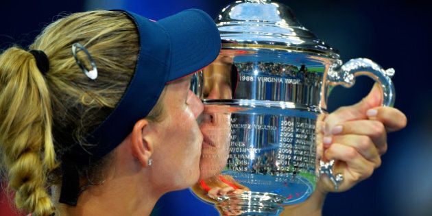 NEW YORK, NY - SEPTEMBER 10: Angelique Kerber of Germany kisses the trophy after winning (6-3) (4-6) (6-4) against Karolina Pliskova of the Czech Republic during their Women's Singles Final Match on Day Thirteen of the 2016 US Open at the USTA Billie Jean King National Tennis Center on September 10, 2016 in the Flushing neighborhood of the Queens borough of New York City. (Photo by Alex Goodlett/Getty Images)