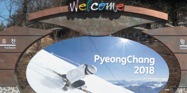 The advertising hoarding promoting the 2018 Winter Olympics stands in the mountain cluster of PyeongChang February 9, 2015. PyeongChang county located in the Taebaek Mountains of Korea, will host the 23rd Winter Olympics from February 9 to February 25 of 2018. The Games are gathered around 13 competition venues in the mountain resort of Alpensia and the coastal city of Gangneung. Picture taken February 9, 2015. REUTERS/Pawel Kopczynski (SOUTH KOREA - Tags: CITYSCAPE OLYMPICS SPORT)