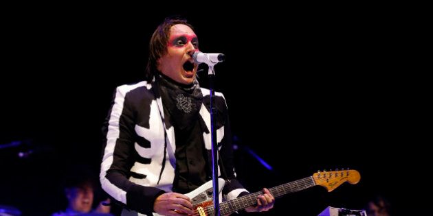 Lead vocalist Win Butler of rock band Arcade Fire performs at the Coachella Valley Music and Arts Festival in Indio, California April 13, 2014. REUTERS/Mario Anzuoni (UNITED STATES - Tags: ENTERTAINMENT)