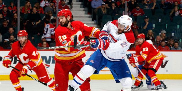 CALGARY, AB - MARCH 9: Deryk Engelland #29 of the Calgary Flames skates against Dwight King #21 of the Montreal Canadiens during an NHL game on March 9, 2017 at the Scotiabank Saddledome in Calgary, Alberta, Canada. (Photo by Gerry Thomas/NHLI via Getty Images)