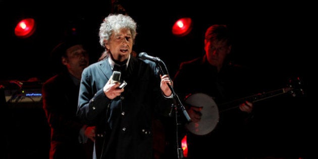 Singer Bob Dylan performs during a segment honoring Director Martin Scorsese, recipient of the Music+ Film Award, at the 17th Annual Critics' Choice Movie Awards in Los Angeles January 12, 2012. REUTERS/Mario Anzuoni/File Photo