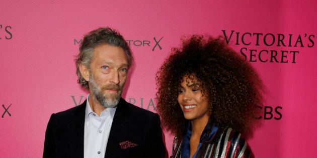Actor Vincent Cassel (R) and his partner Tina Kunakey pose during a photocall before the 2016 Victoria's Secret Fashion Show at the Grand Palais in Paris, France, November 30, 2016. REUTERS/Benoit Tessier FOR EDITORIAL USE ONLY. NOT FOR SALE FOR MARKETING OR ADVERTISING CAMPAIGNS