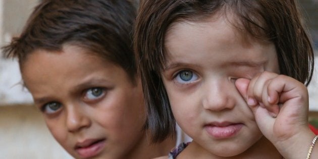 JARABULUS, SYRIA - SEPTEMBER 01: Children are seen after the district's centrum is rescued from Daesh terrorists during the 'Operation Euphrates Shield' led by Turkish Army and backed by Syrian National Coalition forces including Free Syrian Army (FSA) in Jarabulus, Syria on September 01, 2016. (Photo by Cem Ozdel/Anadolu Agency/Getty Images)