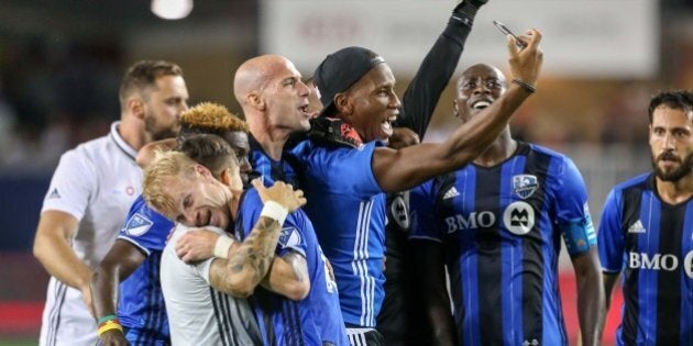 Aug 27, 2016; Toronto, Ontario, CAN; Montreal Impact forward Didier Drogba (11) takes a selfie with teammates after defeating Toronto FC 1-0 at BMO Field. Mandatory Credit: Kevin Sousa-USA TODAY Sports