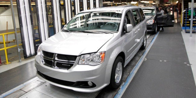 Chrysler Group LLC Dodge Grand Caravan vehicles move down the production line at Chrysler's assembly plant in Windsor, Ontario, Canada, on Tuesday, Jan. 18, 2011. Chrysler Group LLC, the U.S. automaker operated by Fiat SpA, will begin selling hybrid versions of its 300 sedan next year as well as of its next-generation minivan later, the companies' top executive said. Photographer: Jeff Kowalsky/Bloomberg via Getty Images