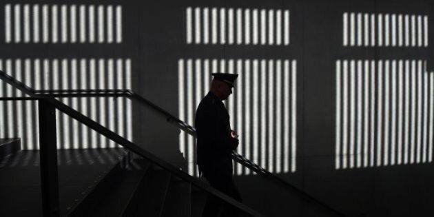 A police officer passes the entrance area of the new high security courtroom of the regional appeal court of Munich, southern Germany, ahead the official opening ceremony on September 5, 2016.The 270 square meter high security courtroom was built on the ground of the Munich Stadelheim's prison. 250 spectators can now take part here to high security-related processes. / AFP / CHRISTOF STACHE (Photo credit should read CHRISTOF STACHE/AFP/Getty Images)