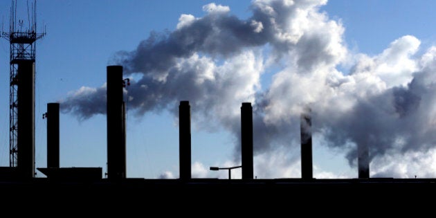 FILE - In this Jan. 7 2015 file photo, smoke emits from a factory chimneys near O'Hare airport in Chicago. The Institute for Supply Management releases its manufacturing index for March on Wednesday, April 1, 2015. (AP Photo/Nam Y. Huh, File)