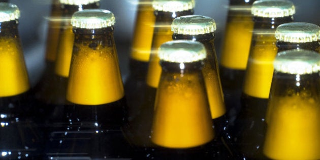 Bottles of Taller lager move along the production line at the OAO SUN Inbev beer plant, a unit of Anheuser-Busch InBev NV, in Chernihiv, Ukraine, on Friday, March 3, 2017. SUN InBev brews both national and international beer brands including Bud, Stella Artois and Corona. Photographer: Vincent Mundy/Bloomberg via Getty Images