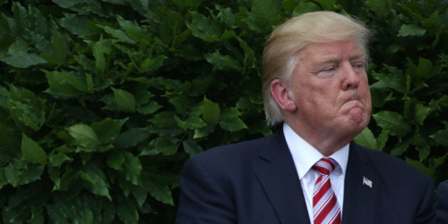 WASHINGTON, DC - JUNE 12: U.S. President Donald Trump listens during a South Lawn event to welcome the Clemson Tigers at the White House June 12, 2017 in Washington, DC. President Trump hosted the team to honor 2016 NCAA Football National Championship. (Photo by Alex Wong/Getty Images)