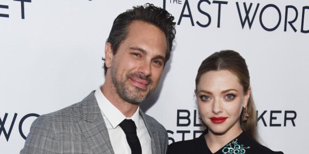 HOLLYWOOD, CA - MARCH 01: Actor Thomas Sadoski (L) and actress Amanda Seyfried arrive at the premiere of Bleecker Street Media's 'The Last Word' at ArcLight Hollywood on March 1, 2017 in Hollywood, California. (Photo by Amanda Edwards/Getty Images )