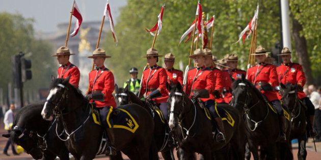 Royal Canadian Mounted Police (RCMP) parade down the Mall in central London, on May 23, 2012, as they prepare to take part in the 'Changing of the Guard' ceremony. Their participation is part of the Queen's Diamond Jubilee celebrations and will also feature women for the first time. AFP PHOTO / Andrew Cowie (Photo credit should read Andrew Cowie/AFP/GettyImages)