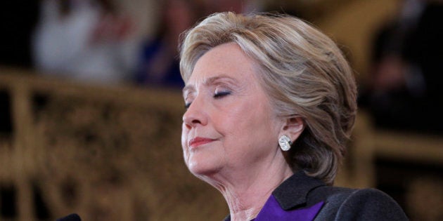 Hillary Clinton pauses as she addresses her staff and supporters about the results of the U.S. election at a hotel in the Manhattan borough of New York, U.S., November 9, 2016. REUTERS/Brian Snyder