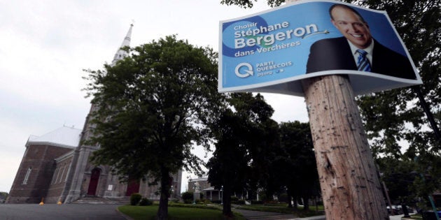 A campaign sign for Parti Quebecois legislator Stephane Bergeron is posted in the Quebec town of Varennes August 17, 2012. Less than two decades ago, in perhaps the most traumatic moment in modern Canadian history, the predominantly French-speaking province of Quebec came within a hair's breadth of voting for independence. And while another vote may still be years away separatist sentiment is back on the agenda as opposition party Parti Quebecois, dedicated to carving Canada into two, heads for victory in the September 4 provincial election. Picture taken August 17, 2012. REUTERS/Christinne Muschi (CANADA - Tags: POLITICS)