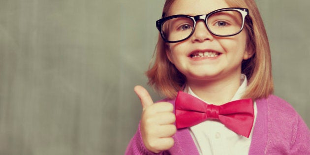 Portrait of a little nerd girl, ready to learn. Vintage processing.