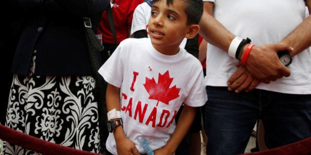 A Syrian refugee waits to shake hands with Canada's Prime Minister Justin Trudeau (not pictured) during Canada Day celebrations on Parliament Hill in Ottawa, Ontario, Canada, July 1, 2016. REUTERS/Chris Wattie