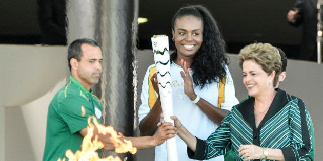 BRASILIA, BRAZIL - MAY 03: Dilma Rousseff President of Brazil receives the Olympic torch at the Palacio do Planalto on May 3, 2016 in Brasilia, Brazil. The Olympic torch will pass through 329 cities from all states from the north to the south of Brazil, until arriving in Rio de Janeiro on August 5, to lit the cauldron. (Photo by Ricardo Botelho/Brazil PhotoPress/LatinContent/Getty Images)