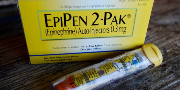 FILE - This Oct. 10, 2013, file photo, shows an EpiPen epinephrine auto-injector, a Mylan product, in Hendersonville, Texas. Mylan, now in the crosshairs over severe price hikes for its EpiPen, said Thursday, Aug. 25, 2016, it will expand programs that lower out-of-pocket costs by as much as half. (AP Photo/Mark Zaleski, File)