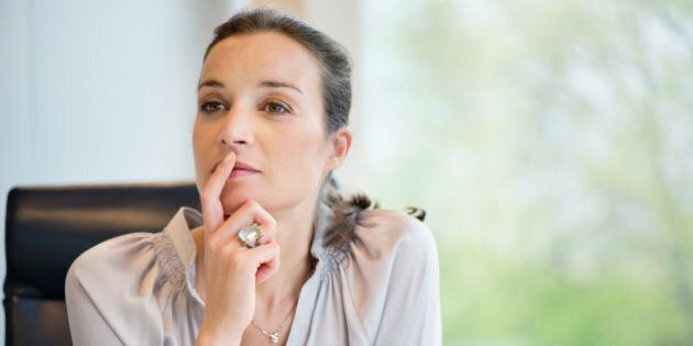 Close-up of a businesswoman thinking in an office