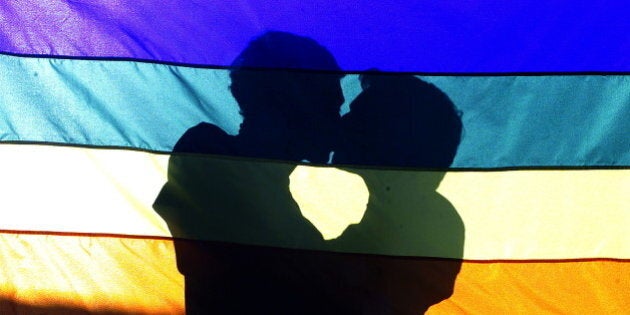 Two men kiss each other during a pro-gay demonstration in front of the Nossa Senhora da Paz church in Rio de Janeiro. Two men kiss each other during a pro-gay demonstration in front of the Nossa Senhora da Paz church in the Ipamena district of Rio de Janeiro, August 03, 2003. HIGH RESOLUTION FILE REUTERS/Bruno Domingos REUTERS BOOKS ON THE ROAD BOOK