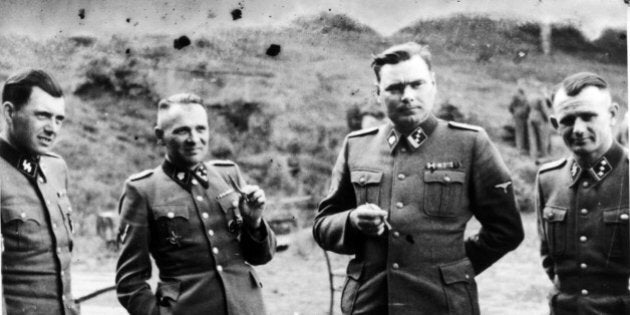 UNSPECIFIED - CIRCA 1754: Dr Josef Mengele (1911-1979) left, known as 'The Angel of Death' for the medical experiments he carried out on the inmates of Auschwitz, the German Nazi concentration. Next to him is Rudolf Hoss, Commandant of Auschwitz: Second from right is Josef Kramer, Commandant of Belsen: Right, an unidentified German officer. (Photo by Universal History Archive/Getty Images)