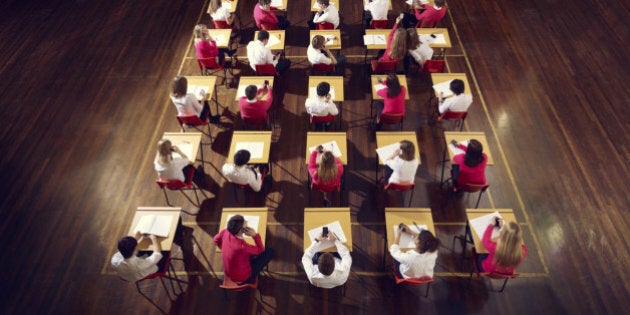 teenagers use mobile phones in exam