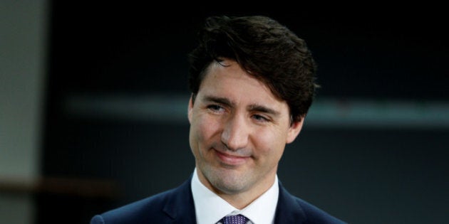 Canadian Prime Minister Justin Trudeau speaks to the press following a robotics demonstration at Kinova Robotics in Boisbriand, Quebec, Canada March 24, 2017. REUTERS/Christinne Muschi