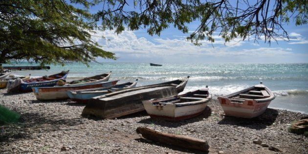 Boats are stored on a beach in the commune of is Anse-a-Pitres, in the South East Department of Haiti, on October 14, 2015. AFP PHOTO/HECTOR RETAMAL (Photo credit should read HECTOR RETAMAL/AFP/Getty Images)