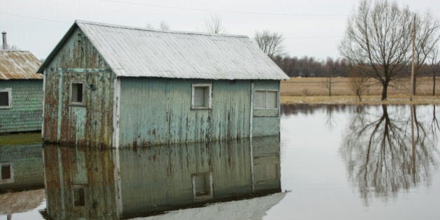 old barn in flooded water