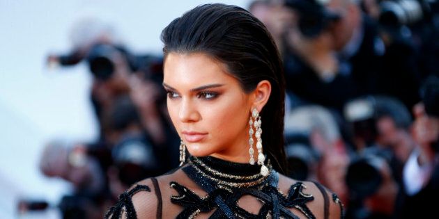 Model Kendall Jenner poses on the red carpet as she arrives for the screening of the film