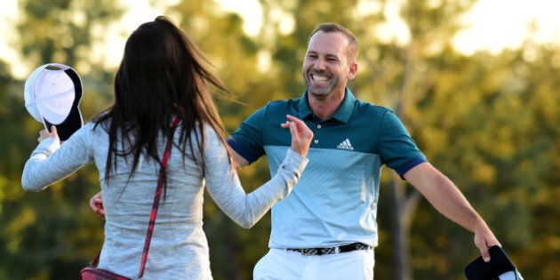 AUGUSTA, GA - APRIL 09: Sergio Garcia of Spain embraces fiancee Angela Akins in celebration after defeating Justin Rose (not pictured) of England on the first playoff hole during the final round of the 2017 Masters Tournament at Augusta National Golf Club on April 9, 2017 in Augusta, Georgia. (Photo by Harry How/Getty Images)