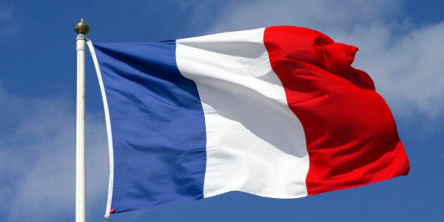 French flag blowing in the wind.