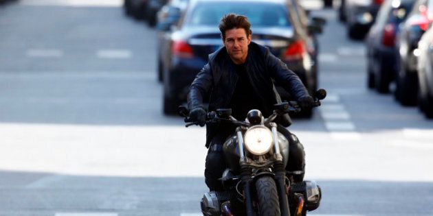 Actor Tom Cruise is seen riding a BMW bike on the set of 'Mission Impossible 6 Gemini' on Avenue de l'Opera on April 30, 2017 in Paris, France. (Photo by Mehdi Taamallah/NurPhoto via Getty Images)
