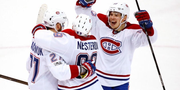 DETROIT, MI - APRIL 08: Alex Galchenyuk #27 of the Montreal Canadiens celebrates his overtime goal with Nikita Nesterov #89 and Artturi Lehkonen #62 to defeat the Detroit Red Wings 3-2 at Joe Louis Arena on April 8, 2017 in Detroit, Michigan. (Photo by Gregory Shamus/Getty Images)