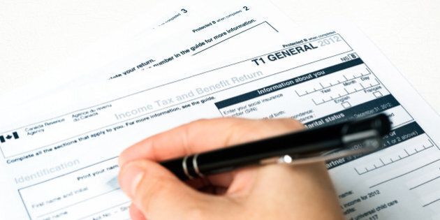 Filling out a 2012 Revenue Canada General T1 Tax Form.