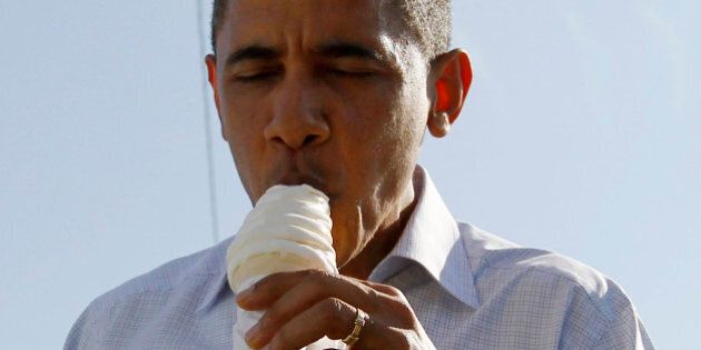 U.S. President Barack Obama eats an ice cream at DeWitt Dairy Treats in DeWitt, Iowa, August 16, 2011. Obama is on a Midwest bus trip through Minnesota, Iowa and Illinois. REUTERS/Jason Reed (UNITED STATES - Tags: POLITICS FOOD)