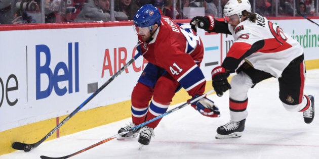 MONTREAL, QC - MARCH 25: Paul Byron #41of the Montreal Canadiens controls the puck while being challenged by Erik Karlsson #65 of the Ottawa Senators in the NHL game at the Bell Centre on March 25, 2017 in Montreal, Quebec, Canada. (Photo by Francois Lacasse/NHLI via Getty Images)