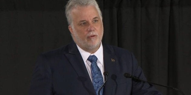 MONTREAL, CANADA - FEBRUARY 2: Premier of Quebec, Philippe Couillard delivers a speech during a funeral ceremony held for six people, who were killed in a shooting at a mosque in Quebec City late Sunday, at Maurice Richard Arena in Montreal, Canada on February 2, 2017. (Photo by Seyit Aydogan/Anadolu Agency/Getty Images)