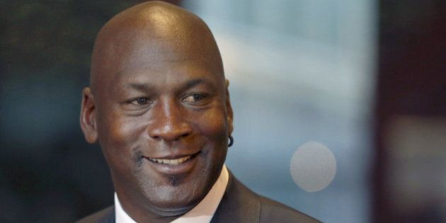 FILE - In this Aug. 21, 2015, file photo, former NBA star and current owner of the Charlotte Hornets, Michael Jordan, smiles at reporters in Chicago. Jordan has made another major donation, pledging $5 million to the Smithsonian's new African-American history museum on the National Mall, officials at the National Museum of African American History and Culture announced Monday, Aug. 8, 2016. (AP Photo/Charles Rex Arbogast, File)