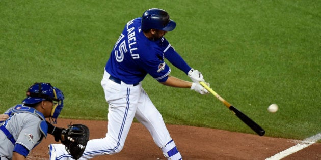 Oct 21, 2015; Toronto, Ontario, CAN; Toronto Blue Jays first baseman Chris Colabello (15) hits a home run during the second inning against the Kansas City Royals in game five of the ALCS at Rogers Centre. Mandatory Credit: Dan Hamilton-USA TODAY Sports